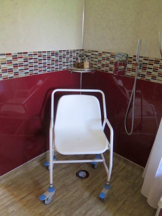 This Height Adjustable Mobile Shower Chair has a braced frame for strength and stability, and is made from durable coated steel.